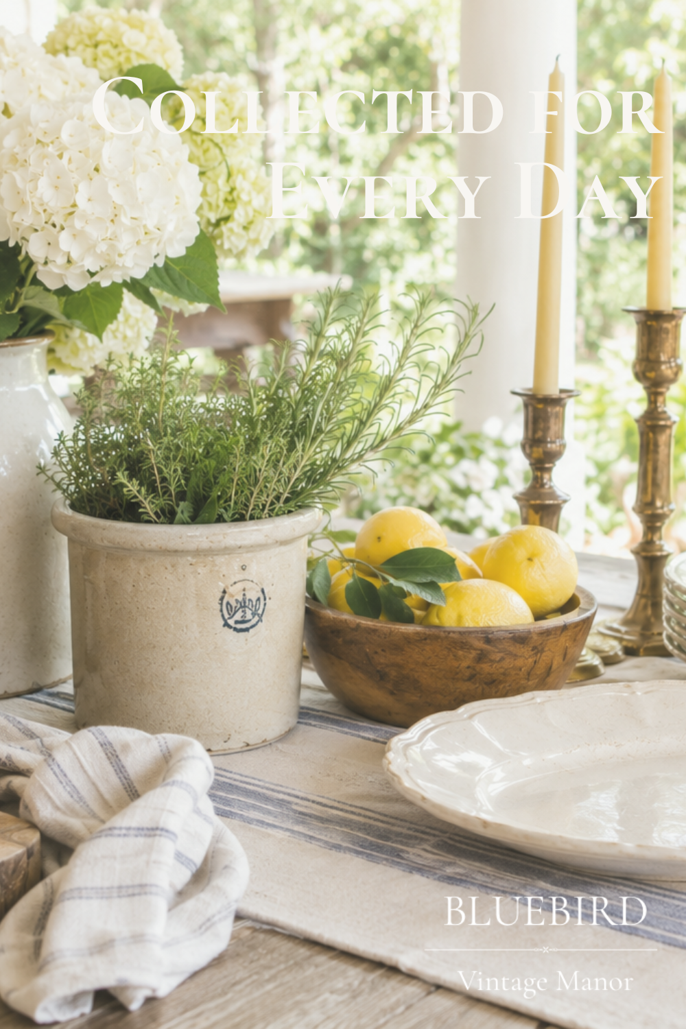 Vintage tableware summer table setting with garden flowers and ironstone plates
