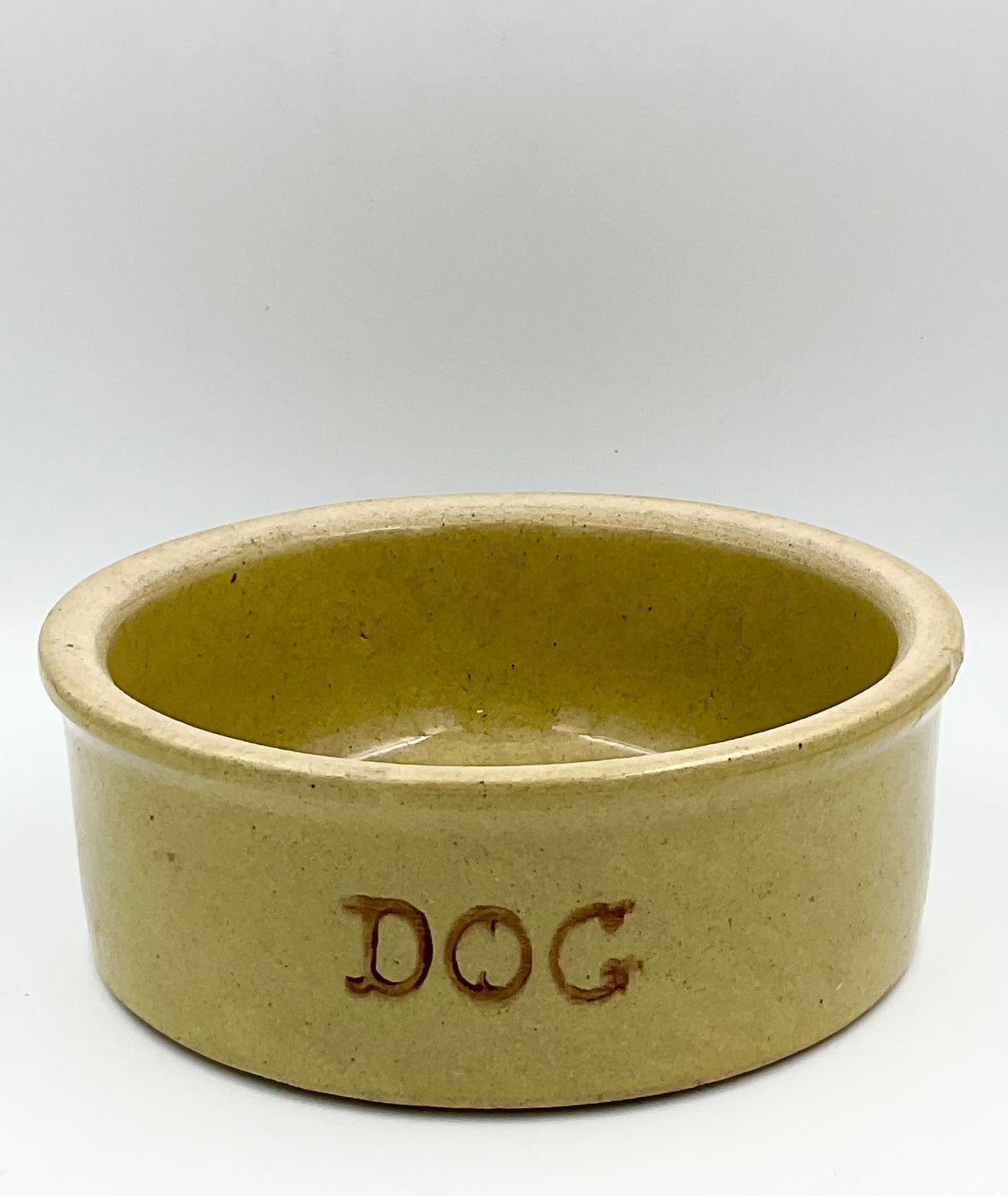 Vintage R.R.P. Co. stoneware dog bowl, front angle