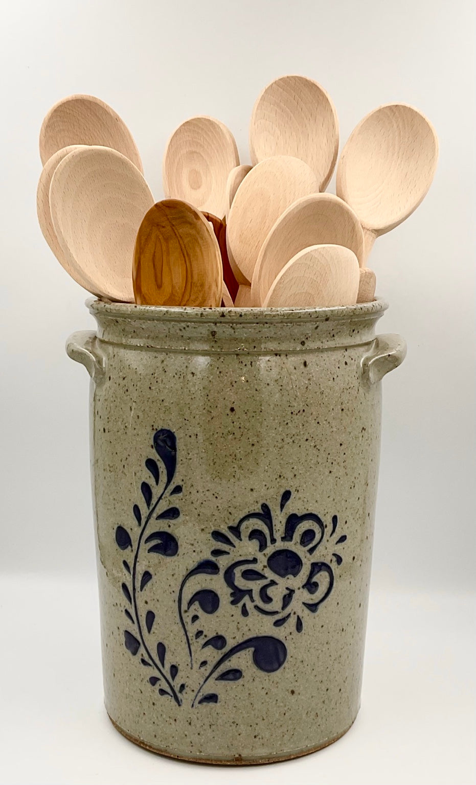 Baumann floral crock styled with wooden spoons, sold separately