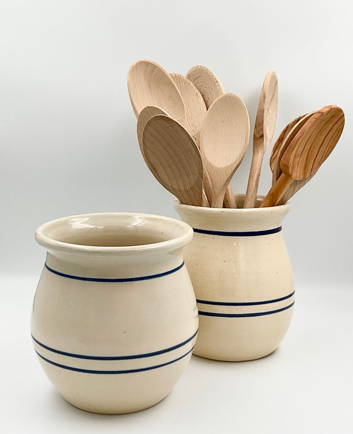 Two Casey Pottery crocks styled together; other crock and wooden spoons sold separately