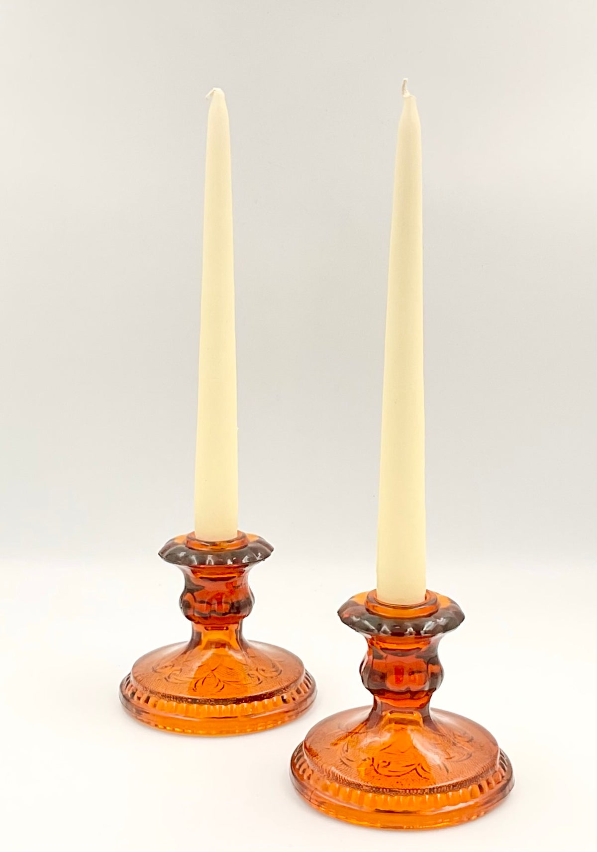 Pair of amber Sandwich candle holders with taper candles