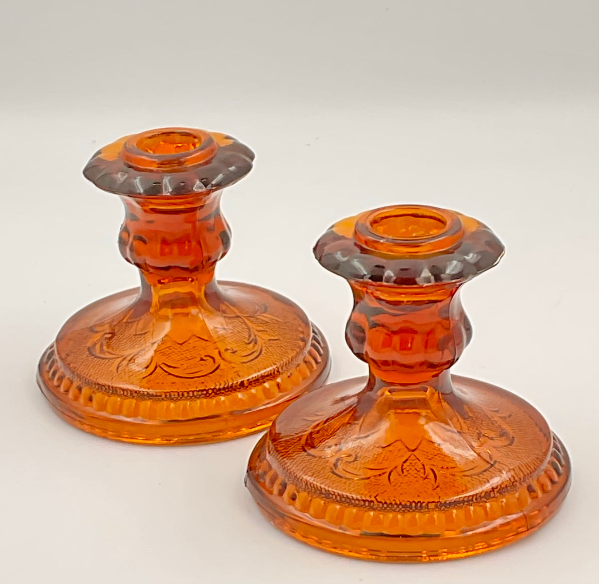 Amber Sandwich candle holders showing floral pattern