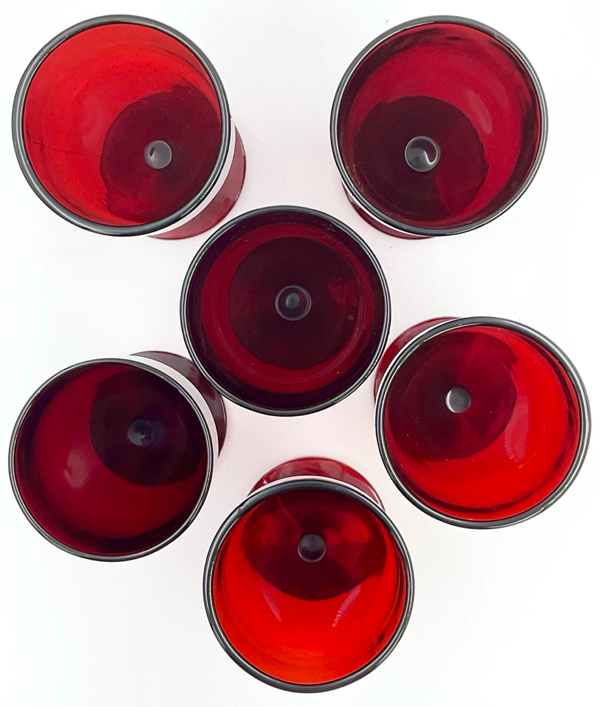 Top view of six ruby red goblets