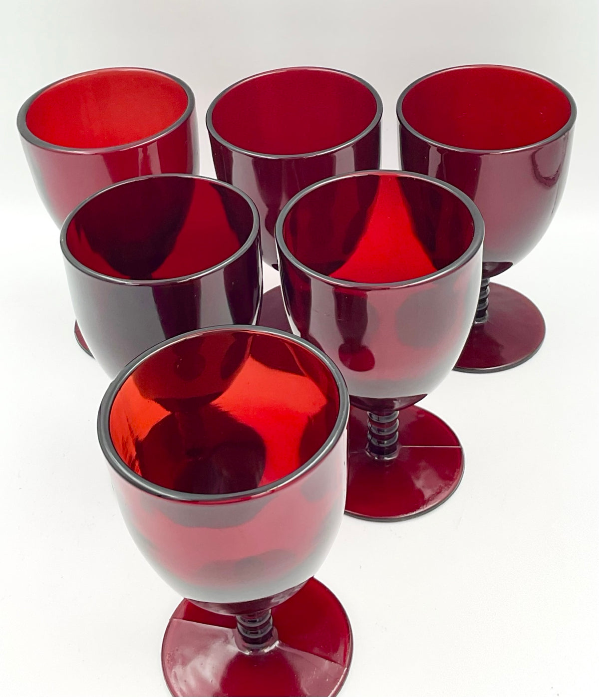 Six Monarch goblets viewed at an angle