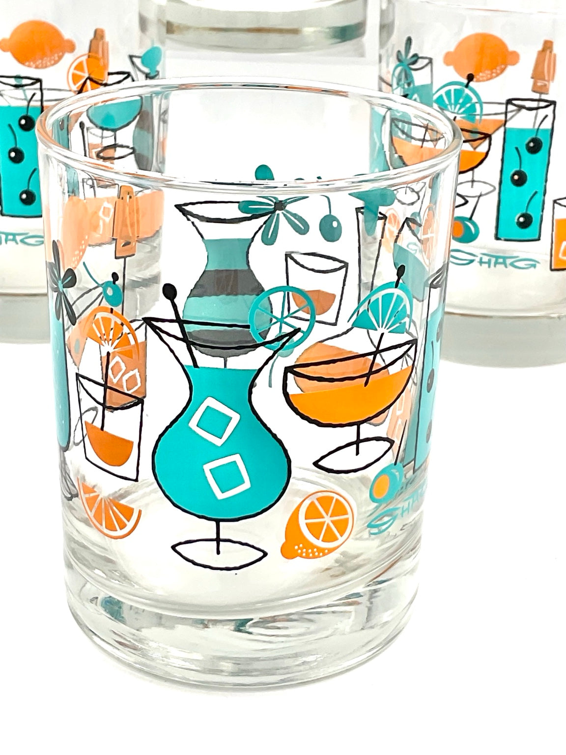 Turquoise cocktail pitcher artwork on SHAG rocks glass