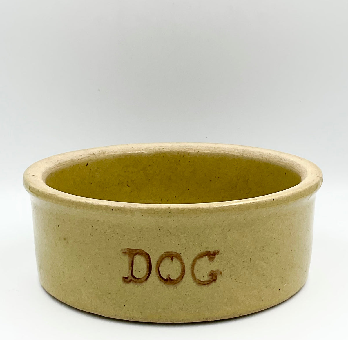 Vintage R.R.P. Co. tan stoneware dog bowl with brown DOG lettering
